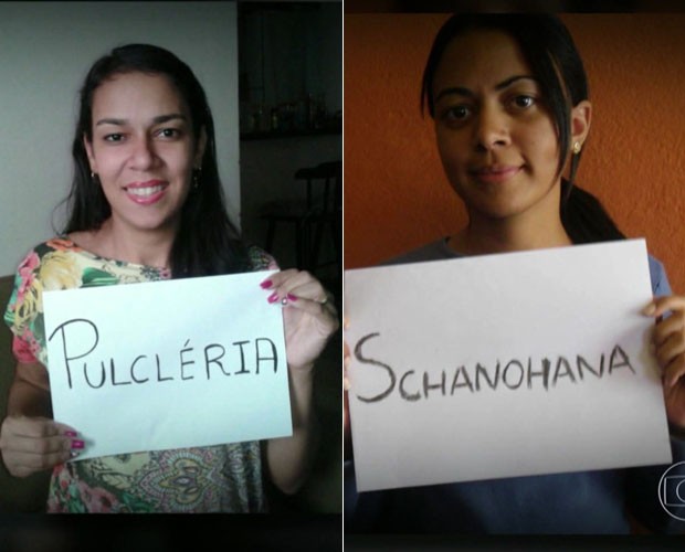 Duas jovens com cartazes em que seus nomes estão escritos: Pulcléria e Schanohana.